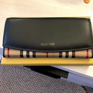 Used Burberry wallet with box, dust bag, and Burberry identification card.